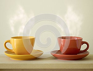 Steaming coffee cup on table