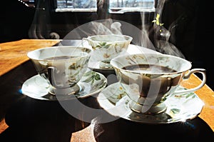 Steaming coffee cups