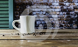 Steaming cup of coffee on wooden table in rustic setting