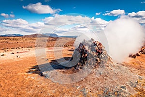 Steaming fumarole in geothermal valley Hverarond, photo
