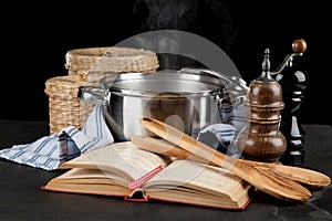 Steaming pot on black background