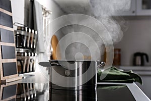 Steaming pot on electric stove in kitchen