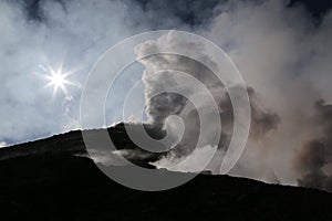 Steaming Volcano etna in Sicily in the morning sun photo