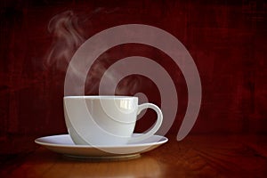 Steaming white cup of coffee or tea photo