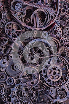 Steampunk background, machine and mechanical parts, large gears and chains from machines and tractors.