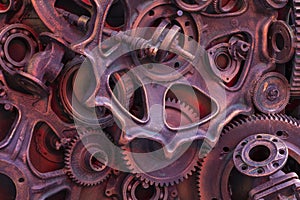 Steampunk background, machine and mechanical parts, large gears and chains from machines and tractors.