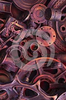 Steampunk background, machine and mechanical parts, large gears and chains from machines and tractors.