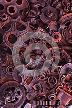 Steampunk background, machine and mechanical parts, large gears and chains from machines and tractors.