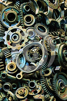 Steampunk background, machine and mechanical parts, large gears and chains from machines and tractors.