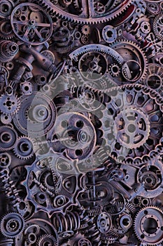 Steampunk background, machine and mechanical parts, large gears and chains from machines and tractors.