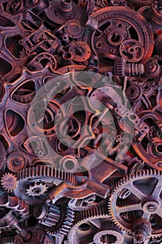 Steampunk background, machine and mechanical parts, large gears and chains from machines and tractors.