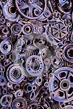 Steampunk background, machine parts, large gears and chains from machines and tractors.