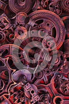 Steampunk background, machine parts, large gears and chains from machines and tractors.