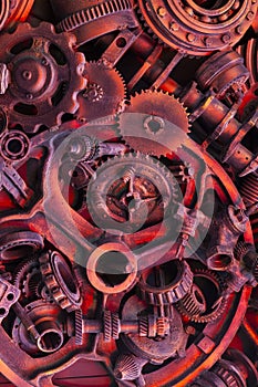 Steampunk background, machine parts, large gears and chains from machines and tractors.