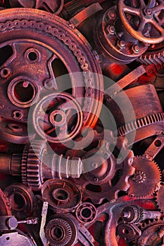 Steampunk background, machine parts, large gears and chains from machines and tractors.