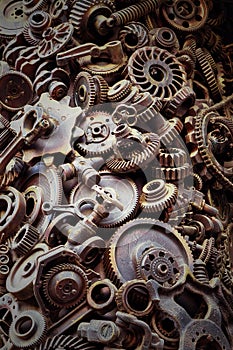 Steampunk background, machine parts, large gears and chains from machines and tractors.