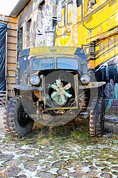 Steampunk bizarre auto with open engine. Creepy truck with rusted parts