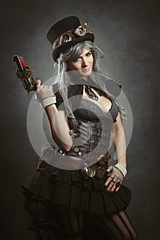 Steampunk girl with firearm photo