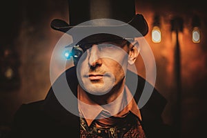 Steampunk man with gun on vintage steampunk background