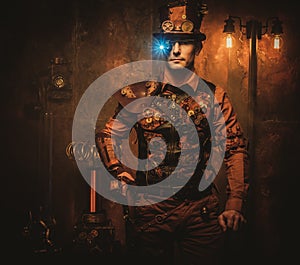 Steampunk man with gun on vintage steampunk background