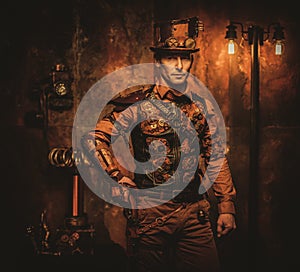 Steampunk man with gun on vintage steampunk background