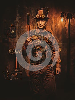 Steampunk man with gun on vintage steampunk background