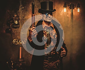 Steampunk man with gun on vintage steampunk background