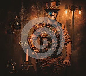 Steampunk man with gun on vintage steampunk background