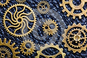 Steampunk mechanical cogs gears wheels on leather background