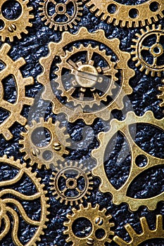 Steampunk mechanical cogs gears wheels on leather background