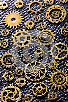 Steampunk mechanical cogs gears wheels on leather background