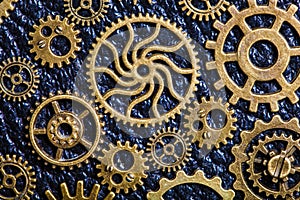 Steampunk mechanical cogs gears wheels on leather background