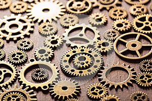 Steampunk mechanical cogs gears wheels on wooden background