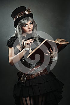 Steampunk scientist with book and lens