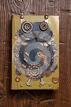 Steampunk style bird owl. Mechanical animal photo.