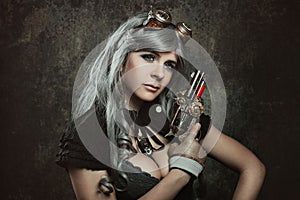 Steampunk woman with mechanical gun