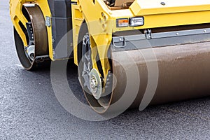 Steamroller at asphalt pavement