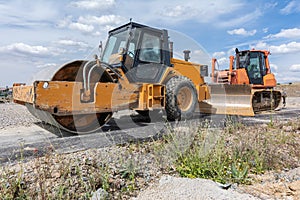 A steamroller at a road construction site