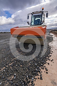 A steamroller on a road construction site