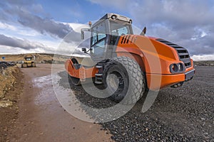 A steamroller on a road construction site