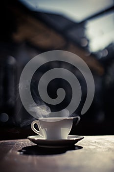 Steamy coffee cup in the sunlight