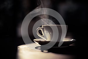 Steamy coffee cup in the sunlight