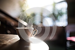 Steamy coffee cup in the sunlight