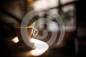 Steamy coffee cup in the sunlight