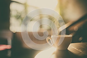 Steamy coffee cup in the sunlight