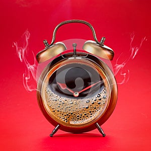 Steamy coffee drink collage. Hot coffee inside of a`larm clock as a symbol coffee time