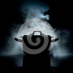 Steamy mystery Pot emitting steam, dark logo, saucepan in shadows