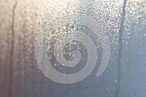 Steamy window glass background macro selective focus