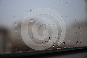 Steamy window and raindrops.