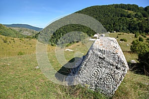 Stecak tombstones decorated with symbolic motifs located close to Umoljani village in the Bjelasnica mountains photo